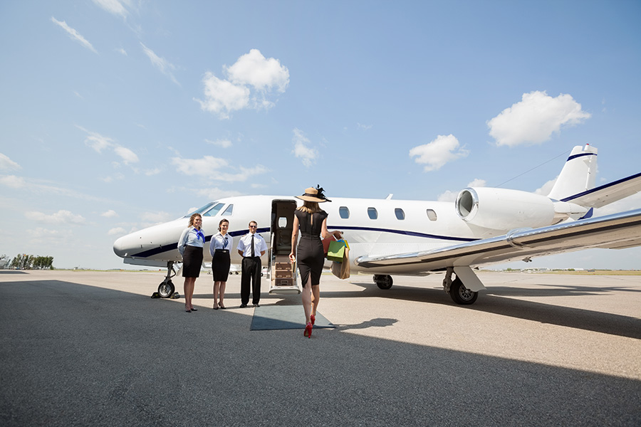 a women about to board a private jet charter