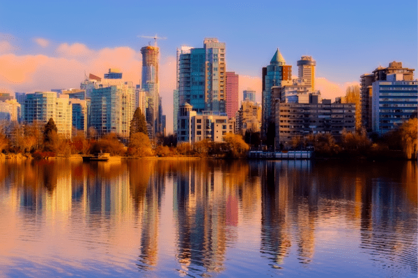 The Vancouver skyline at sunset, with autumn leaves on the trees