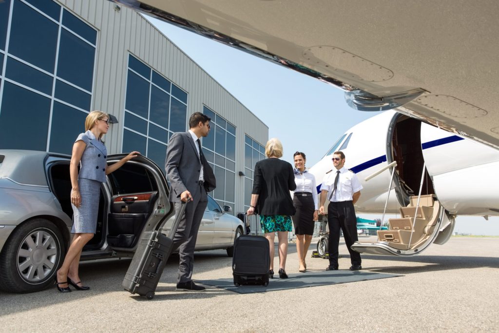 Business people boarding a private jet