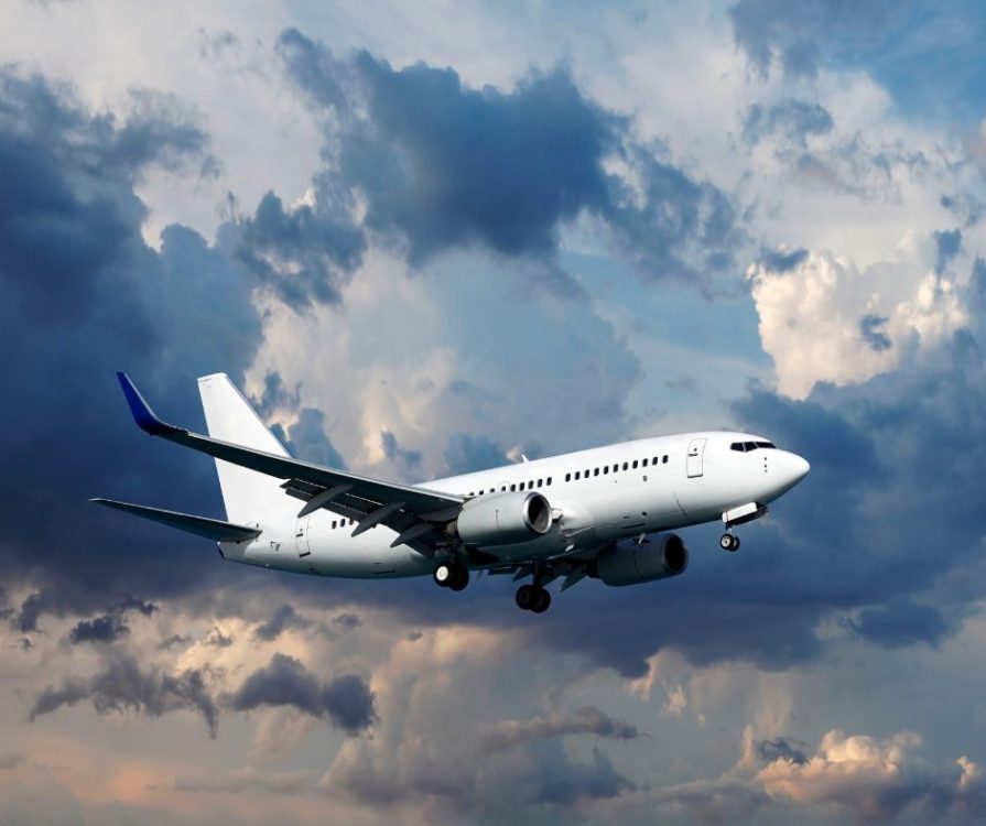 Passenger aircraft against a cloudy sky