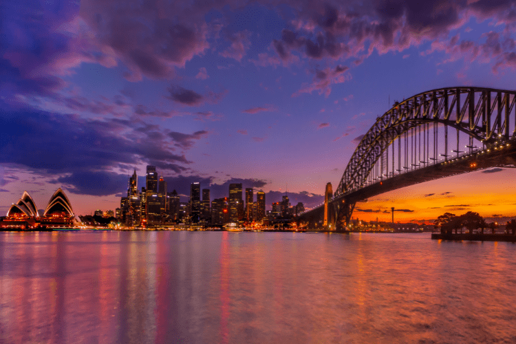 Sydney, Australia with a purple and orange sunset