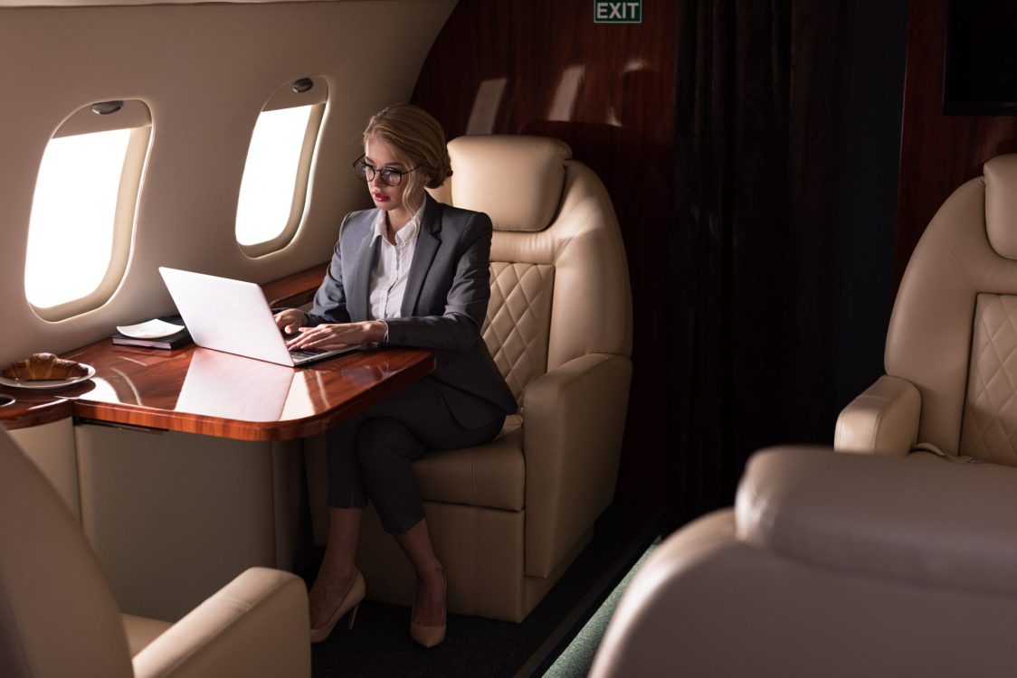 business woman on private jet