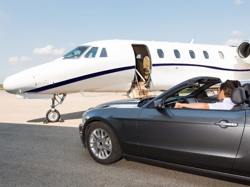 Business partners boarding on group private jet charter