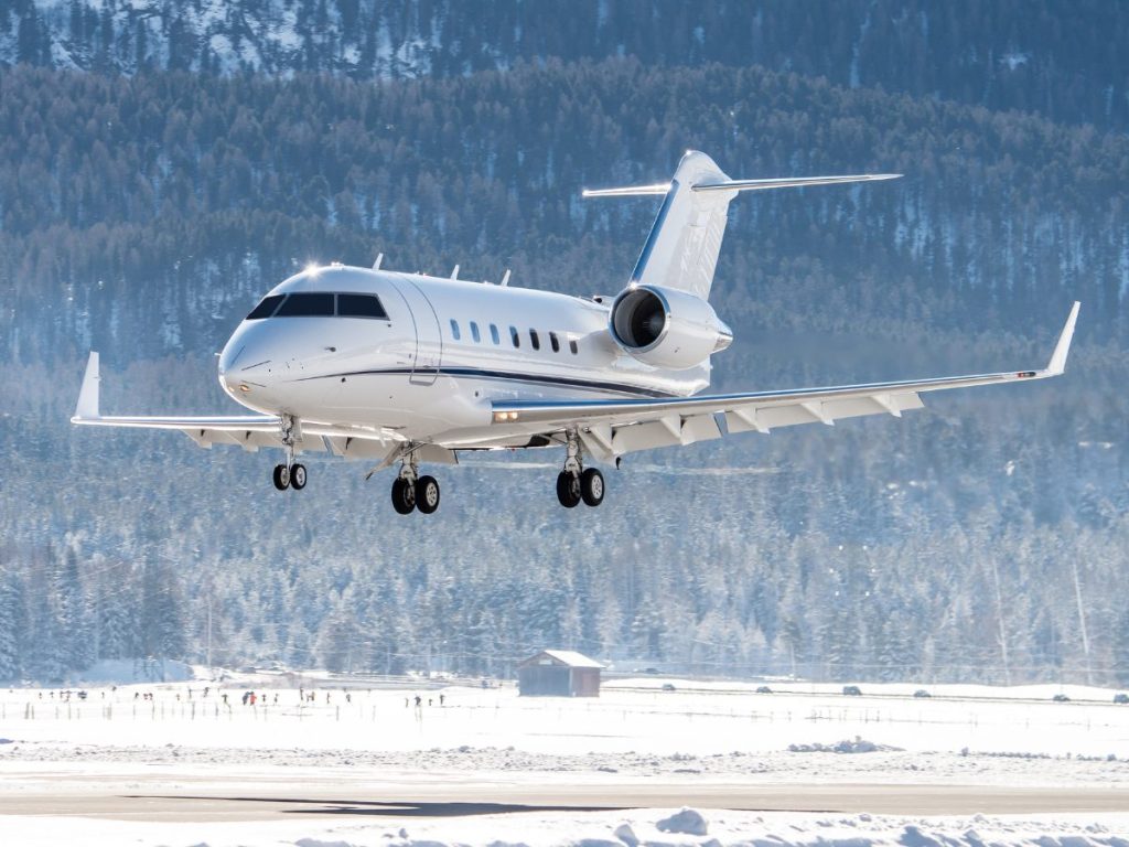 Business jet Landing at an airfield in the mountains of Switzerland