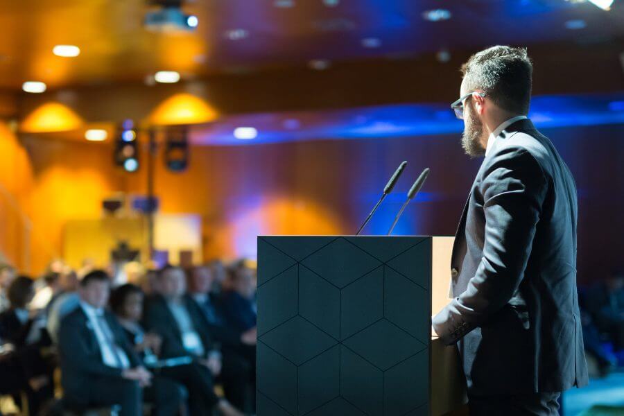 Speaker giving a talk on corporate business conference
