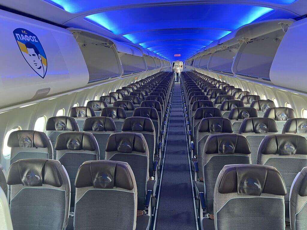 an aircraft interior branded with pafos fc